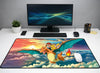 Large 24x12 inch Pokémon mousepad featuring Ash and Pikachu riding Charizard through a colorful sunset sky over the clouds.