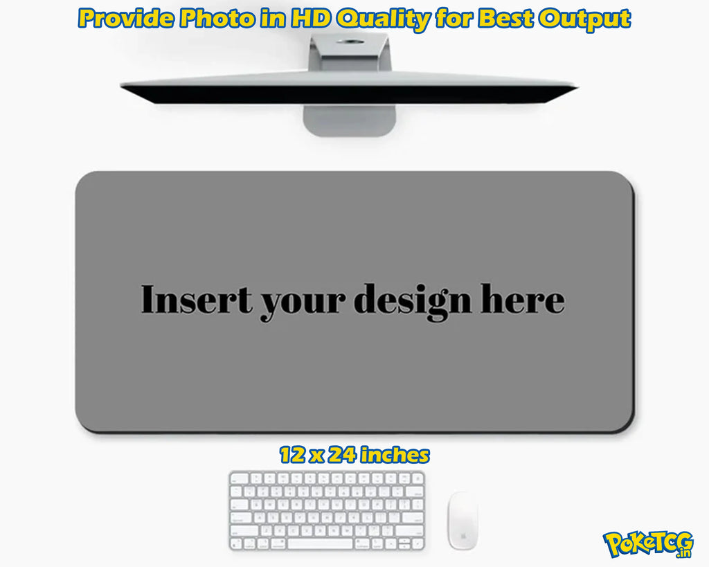 A customizable gray desk mat mockup shown on a white background, with a monitor above, a keyboard and mouse below, and text reading 'Insert your design here' and '12 x 24 inches'.