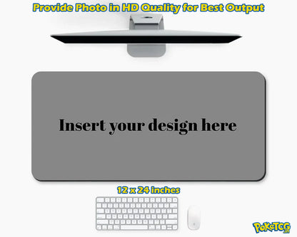 A customizable gray desk mat mockup shown on a white background, with a monitor above, a keyboard and mouse below, and text reading 'Insert your design here' and '12 x 24 inches'.