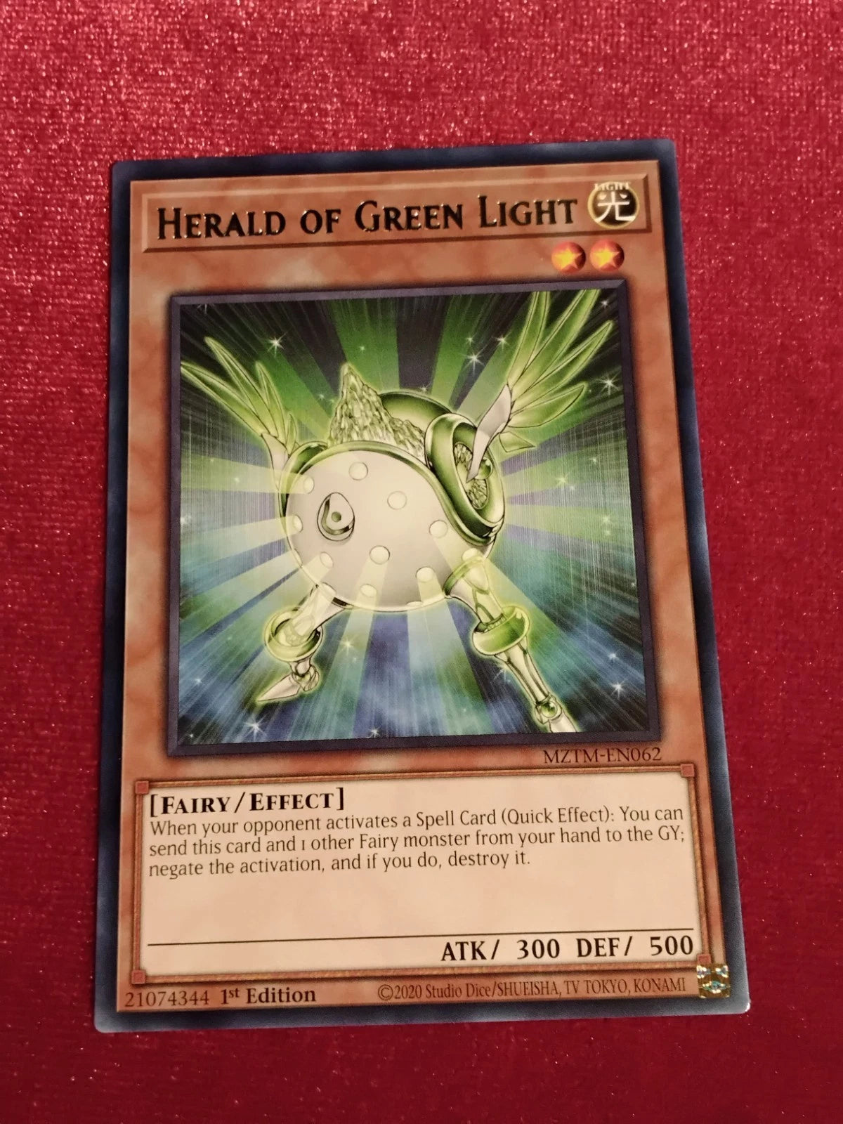 Yu-Gi-Oh! TCG Herald of Green Light MZTM-EN062 rare English card from Maze of Millennia set featuring Spell negation effect.