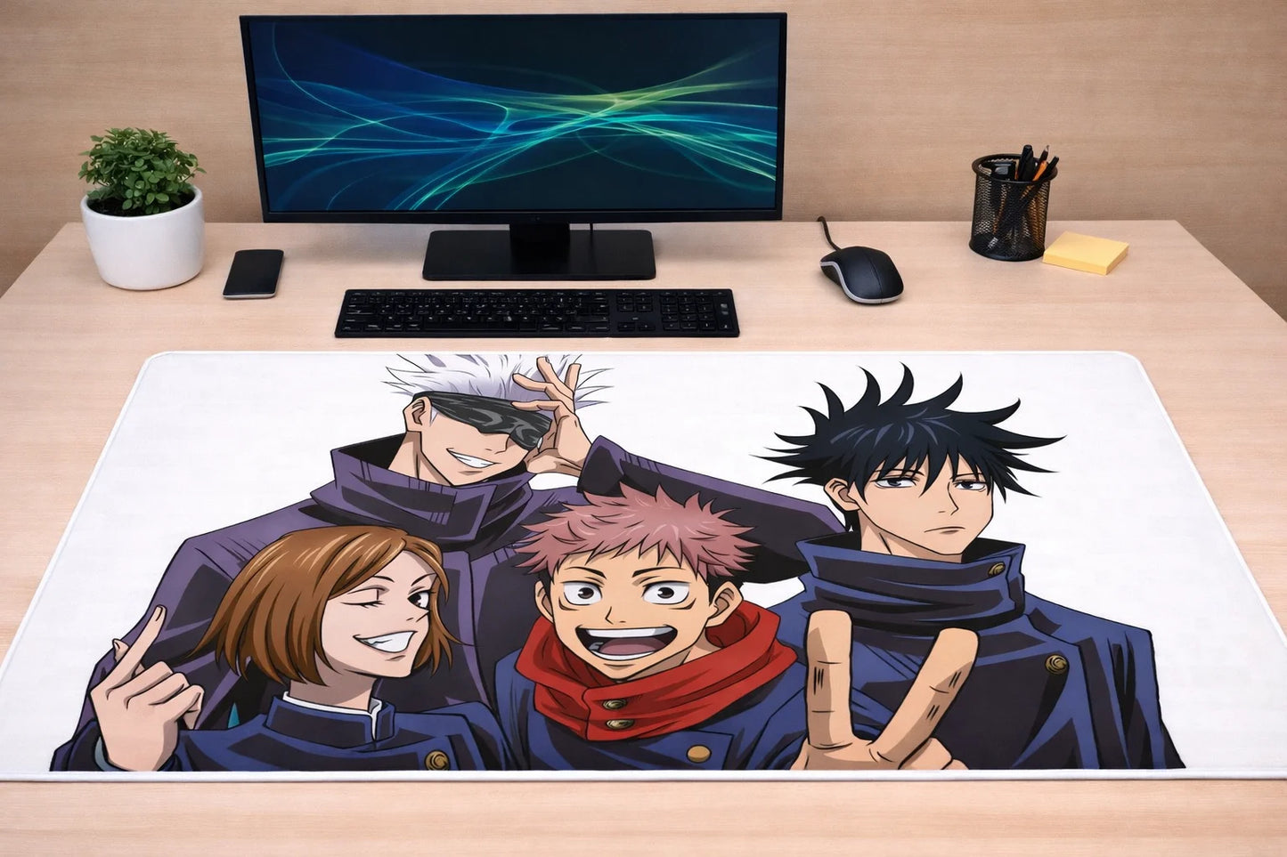 Large 24x12 inch Jujutsu Kaisen mousepad featuring Gojo, Yuji, Megumi, and Nobara on a professional gaming desk setup.