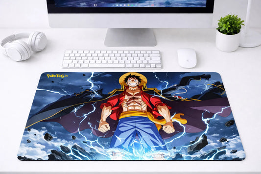 Large 24x12 inch One Piece mousepad featuring Luffy with blue lightning energy effects on a clean gaming desk setup.