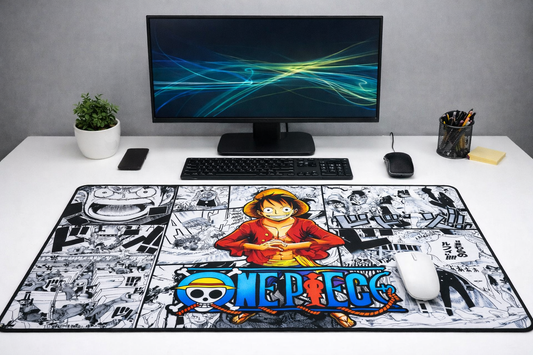 Large 24x12 inch One Piece Luffy manga-style XXL mousepad on a white desk setup, featuring a high-precision fabric surface and non-slip rubber base.