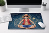 Monkey D. Luffy One Piece XXL gaming mousepad on a desk setup, featuring a high-precision fabric surface and non-slip rubber base.