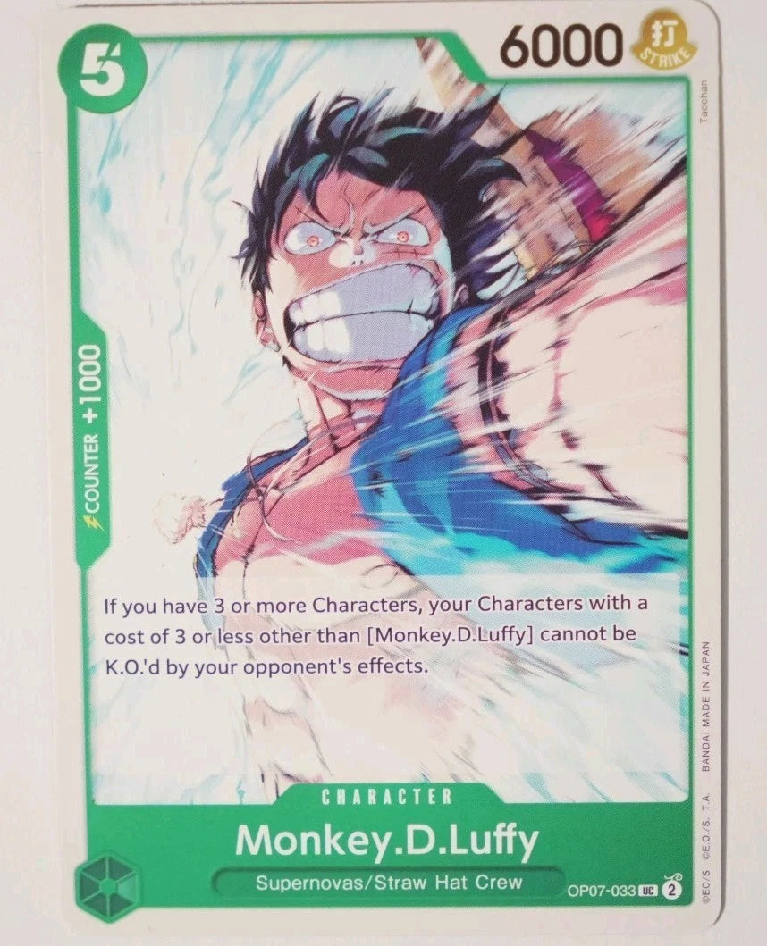 One Piece TCG character card OP07-033 featuring Monkey.D.Luffy in a dynamic sketch-style action pose, grit-teeth and red-eyes, wearing his blue vest against a white and green background.