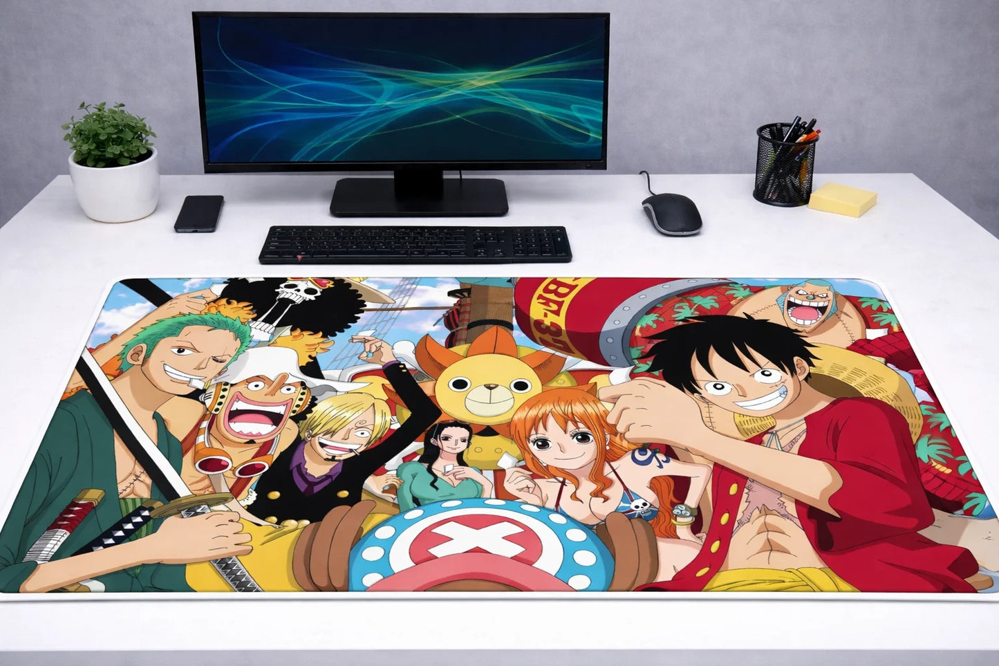 Large 24x12 inch One Piece mousepad featuring the classic Straw Hat crew on a white gaming desk setup.