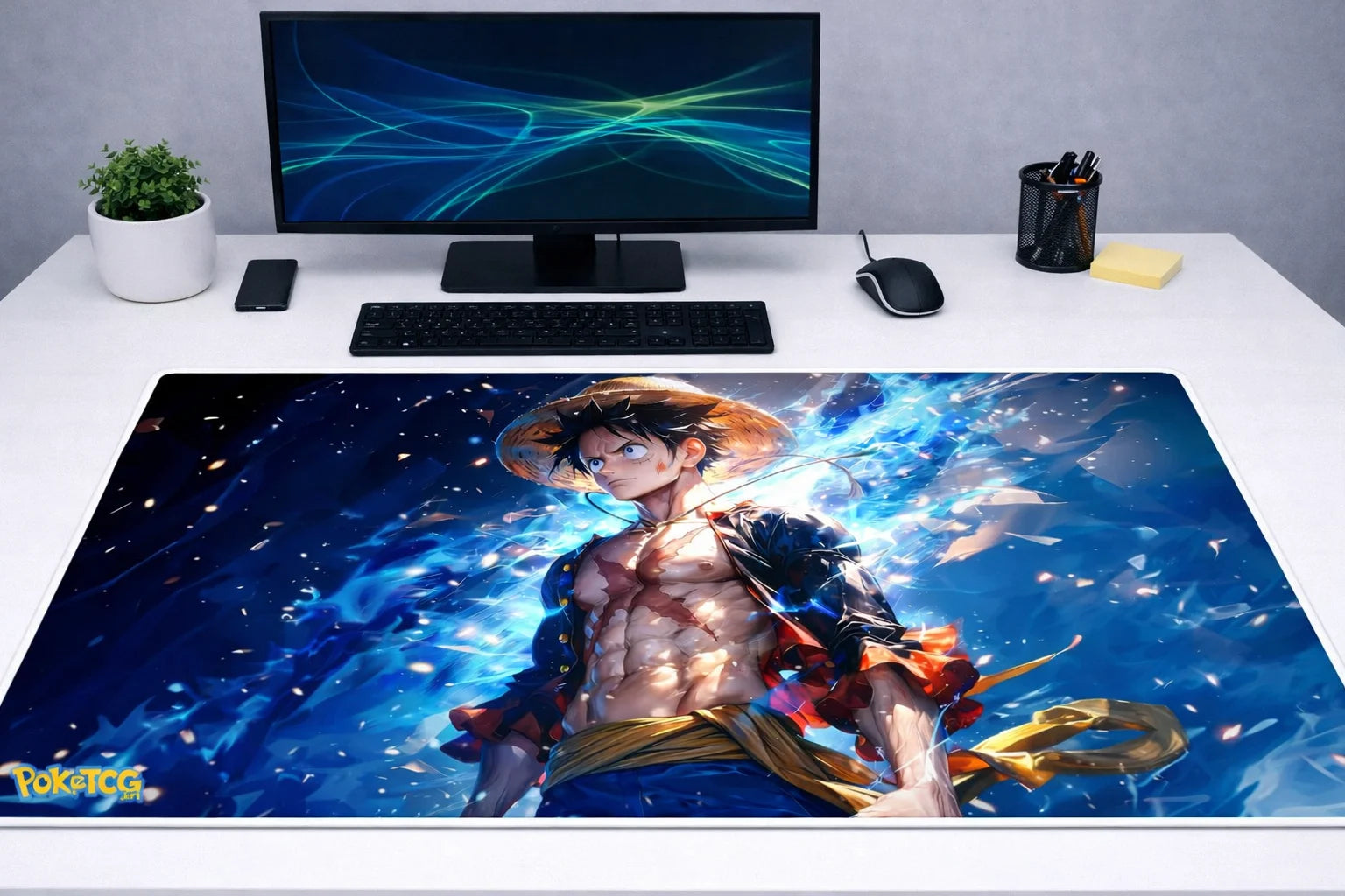 Large 24x12 inch One Piece mousepad featuring an energy-surging Luffy illustration on a modern gaming desk setup.