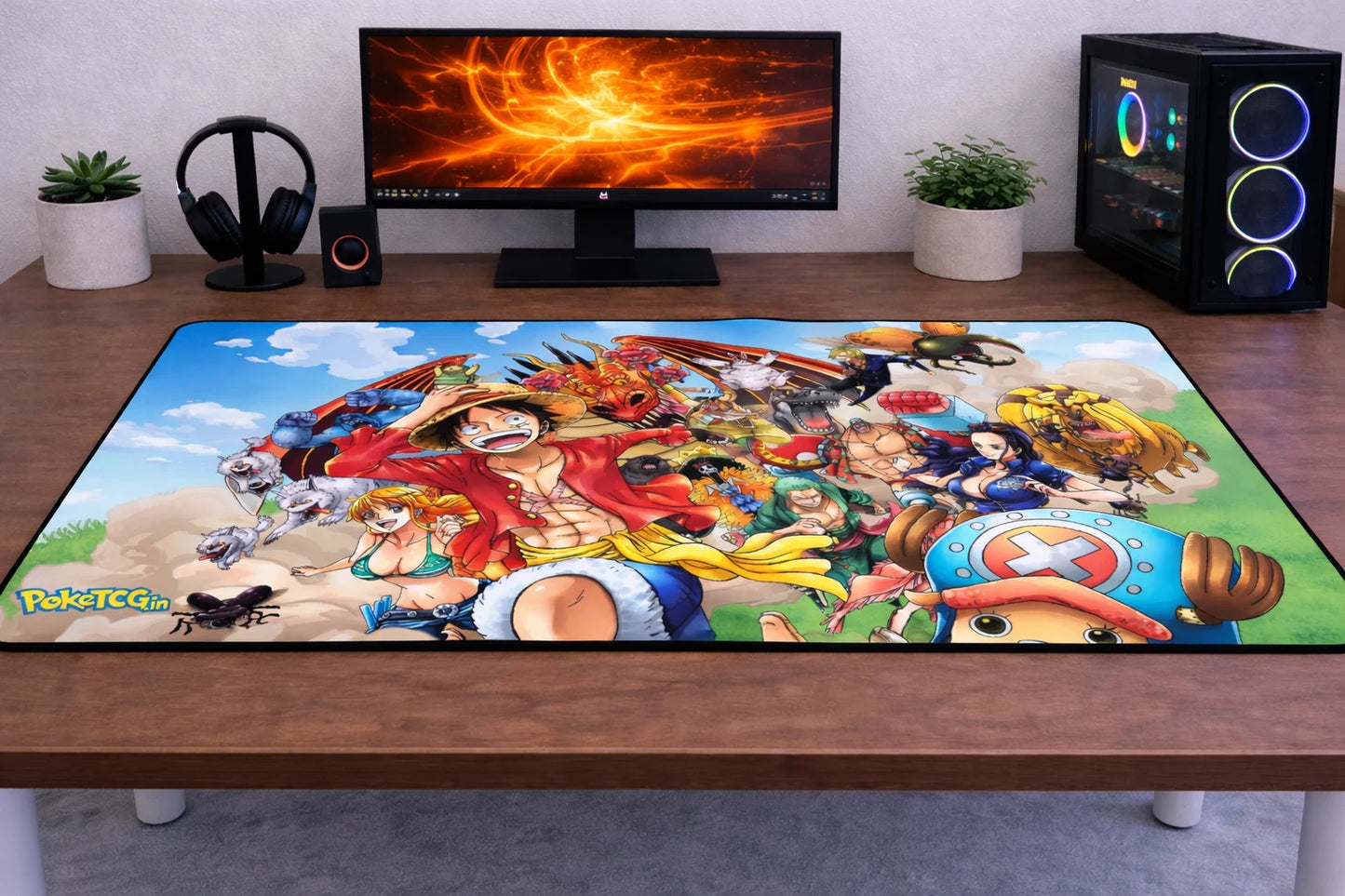 Large 24x12 inch One Piece mousepad featuring Luffy and the Straw Hat crew with vibrant adventure artwork on a clean gaming desk setup.