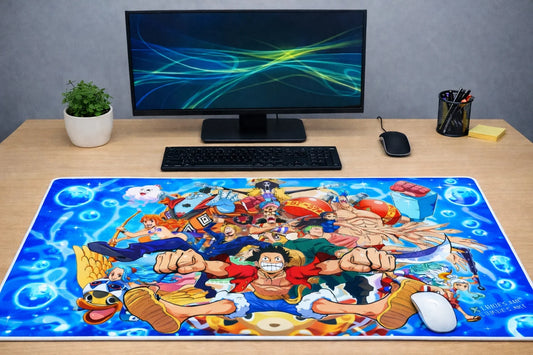 Large 24x12 inch One Piece Wano Country crew XXL mousepad on a wooden desk setup, featuring a high-precision fabric surface and non-slip rubber base.