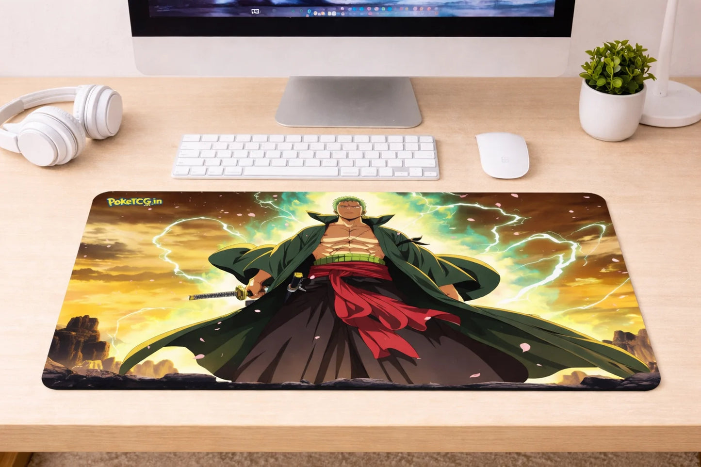 Large 24x12 inch Roronoa Zoro anime mousepad featuring a powerful swordsman illustration with green energy effects on a clean gaming desk setup.