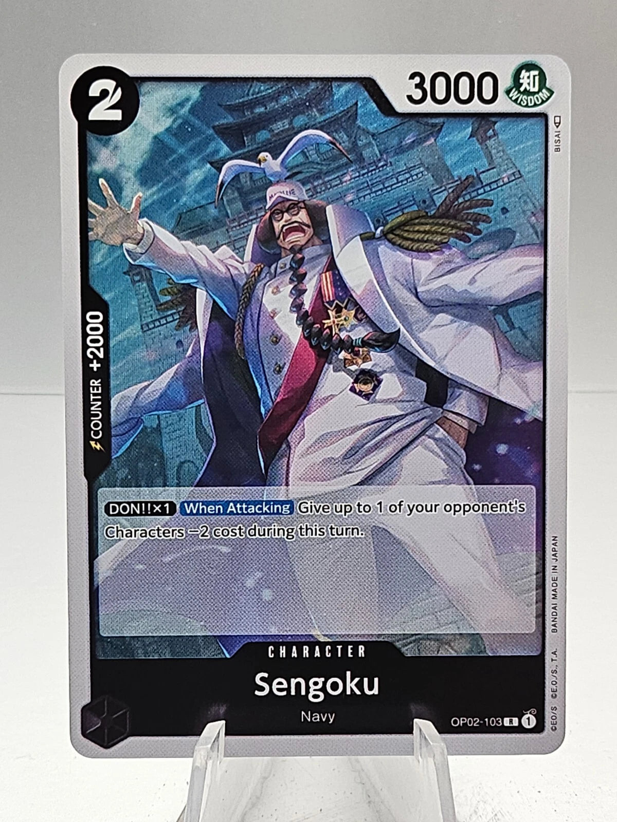 One Piece TCG Sengoku OP02-103 rare holographic card from Paramount War set featuring the Fleet Admiral in a lustrous foil finish.