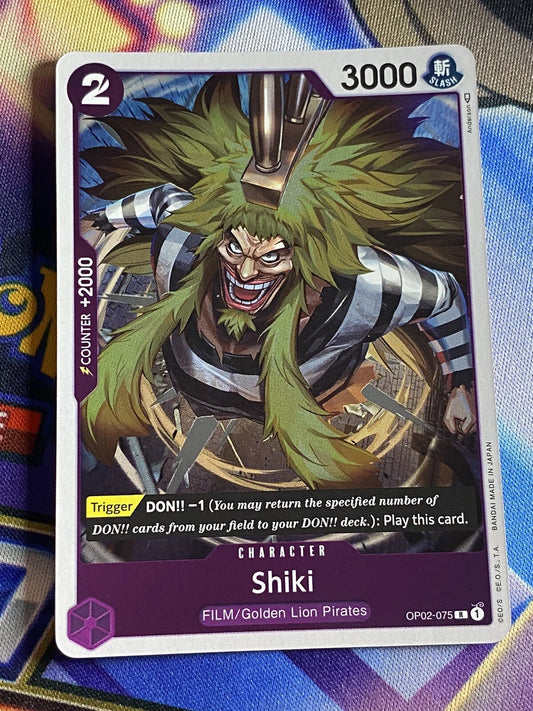 One Piece TCG Shiki OP02-075 rare holographic card from Paramount War set featuring reflective art of the legendary pirate.