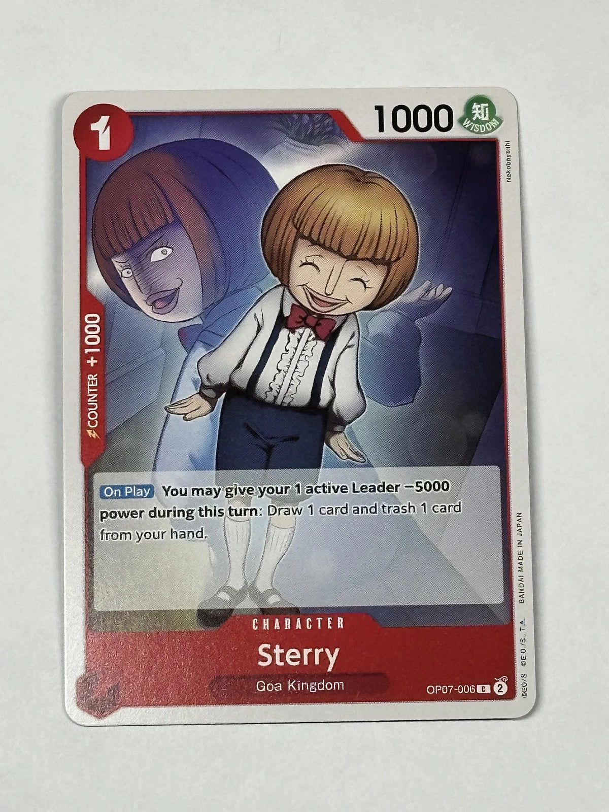 One Piece TCG character card OP07-006 featuring a smiling boy named Sterry in a white shirt and red bowtie, with a large purple-shadowed version of himself behind him.