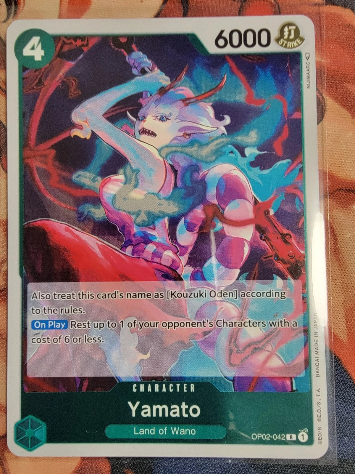 One Piece TCG Yamato OP02-042 rare foil card from Paramount War set featuring 6000 power and On Play resting ability.